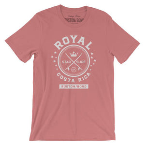 A vintage-inspired Mauve t-shirt with a retro graphic of crossed surfboards and a crown, surrounded by the words ROYAL / STAR SURF / COSTA RICA. By the fashion brand Ruston/Bond, for Wolfsaint.net