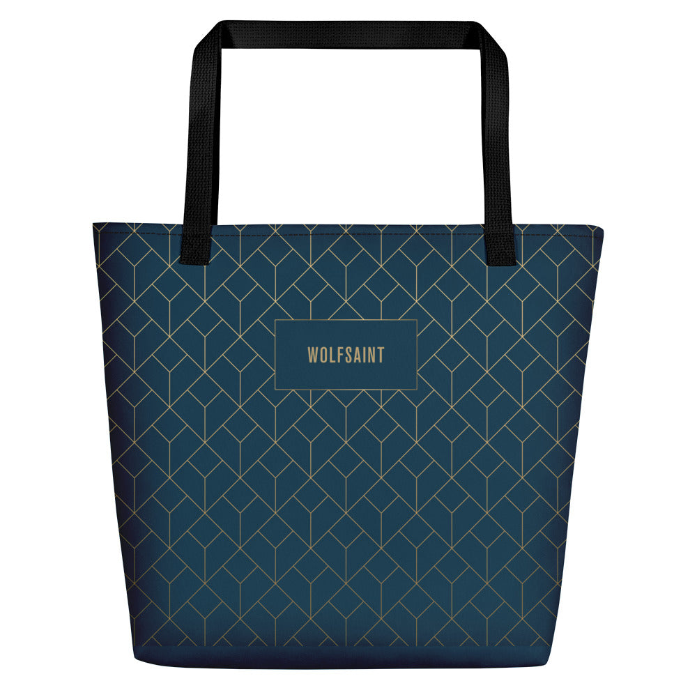 An elegant, fashionable unisex beach or city tote bag in Sea Blue, with an Art Deco style geometric print in ‘gold’ with the WOLFSAINT gothic logo within a blue box. From Wolfsaint.net