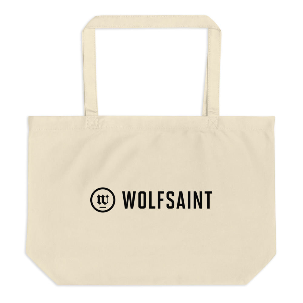 A large simple beach or city tote bag in Natural / off-white, with the WOLFSAINT gothic logo and crest printed in Black. From Wolfsaint.net