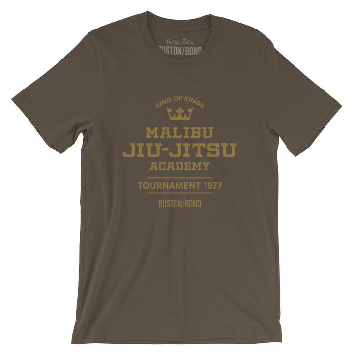 A fashionable, vintage-inspired retro t-shirt in Army green, featuring a graphic commemorating a sarcastic and fictitious Malibu (California) Jiu Jitsu academy and a 1977 tournament. By fashion brand Ruston/Bond, from wolfsaint.net