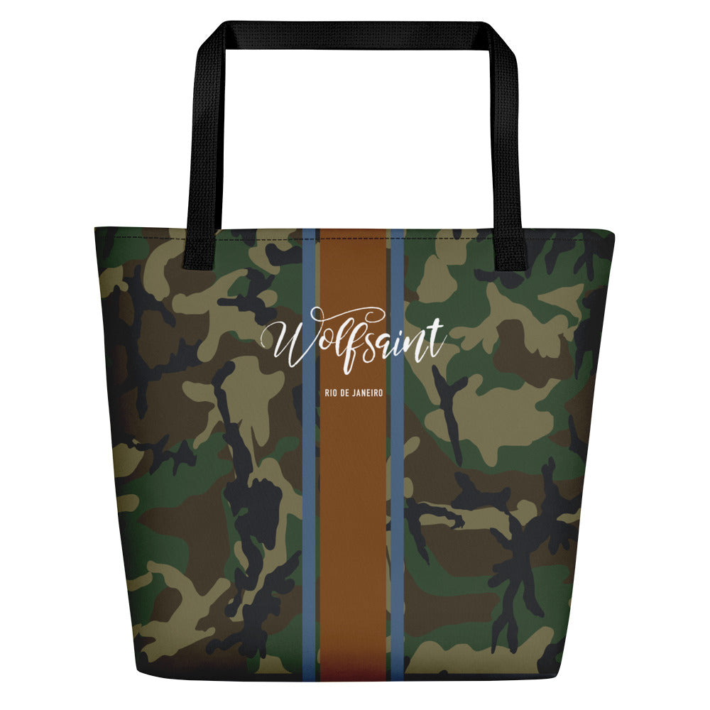 A elegant fashion-branded beach or city tote bag with a camo camouflage all-over pattern, and Solid vertical bands with the WOLFSAINT script logo and “Rio de Janeiro” in small type horizontally across it. From Wolfsaint.net