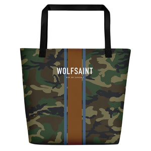A elegant fashion-branded beach or city tote bag with a camo camouflage all-over pattern, and Solid vertical bands with the WOLFSAINT gothic logo and “Rio de Janeiro” in small type horizontally across it. From Wolfsaint.net