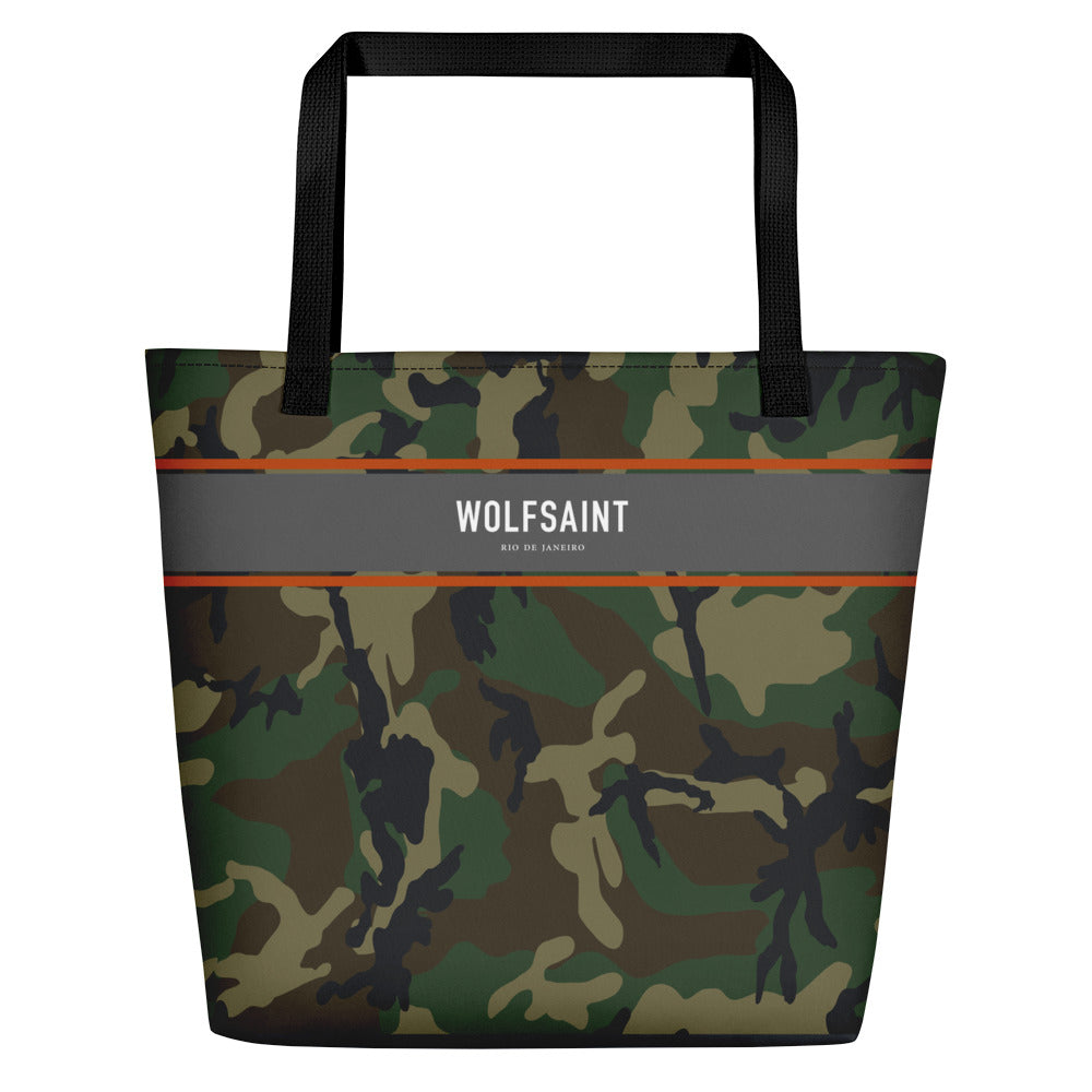 A large sized stylish unisex beach or city tote bag, with an all-over camouflage / camo print, and a thick gray band at the top, with the WOLFSAINT gothic logo and “Rio de Janeiro” in small print. From Wolfsaint.net