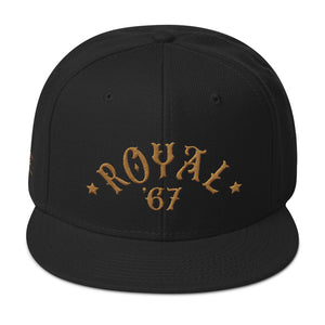 A retro black SnapBack cap with “ROYAL” in classic vintage typography embroidered in an arc above the year ‘67. For Wolfsaint.net