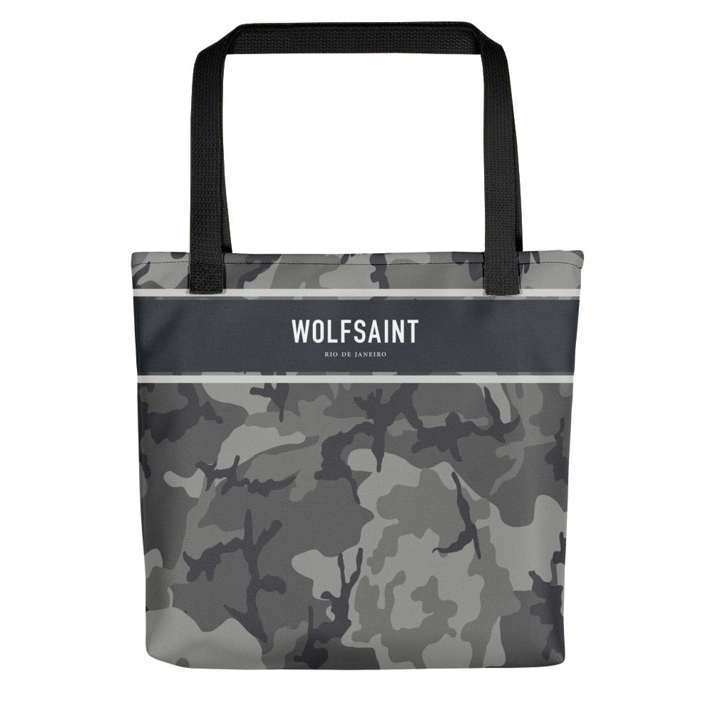A elegant fashion-branded beach or city tote bag with a camo camouflage all-over pattern, and a solid band near the top with the WOLFSAINT gothic logo and “Rio de Janeiro” in small type. From Wolfsaint.net