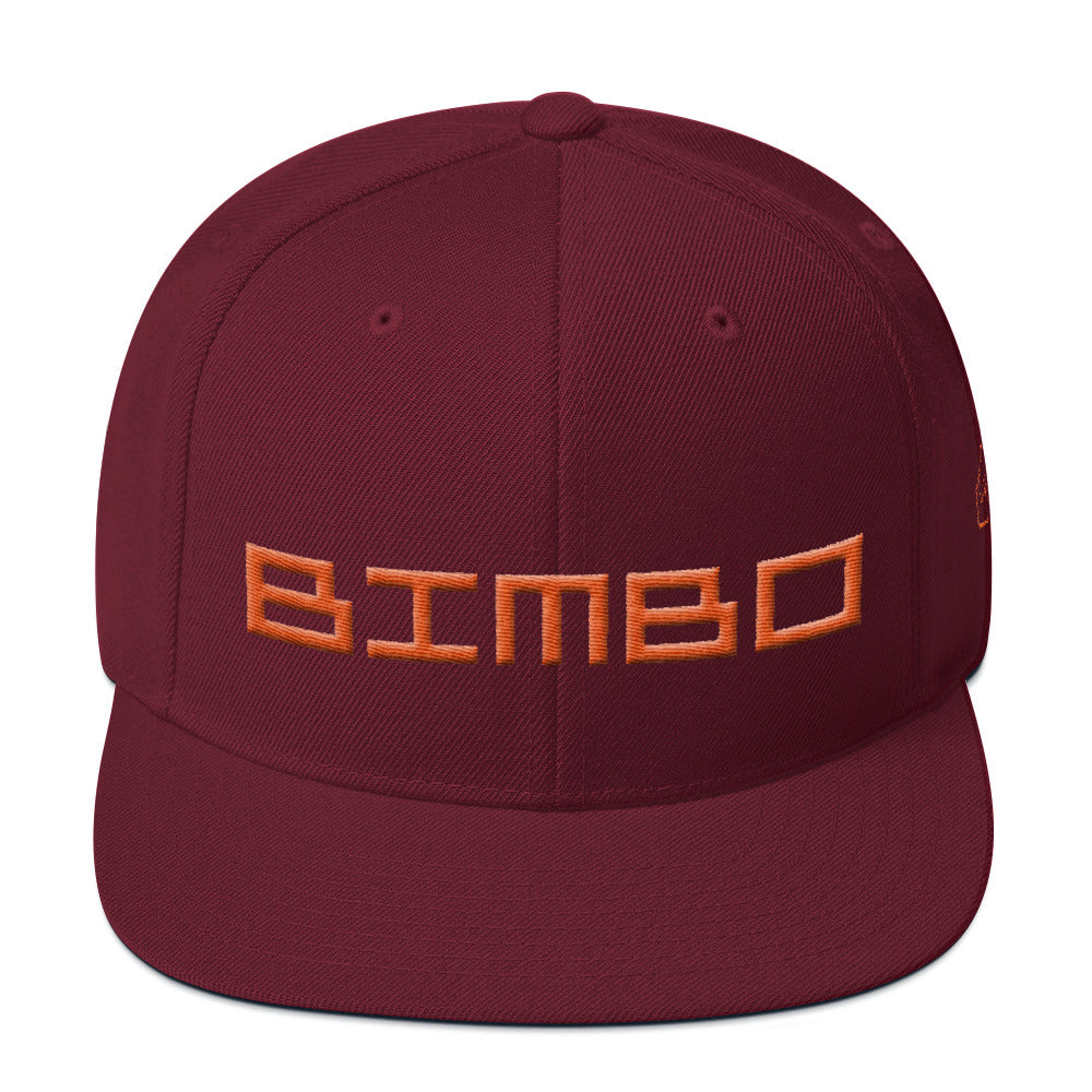 Red / Maroon retro, classic snapback baseball cap with the sarcastic/ironic word BIMBO embroidered in a streetwise square techno font for skateboarders, rappers, athletes, etc. From wolfsaint.net